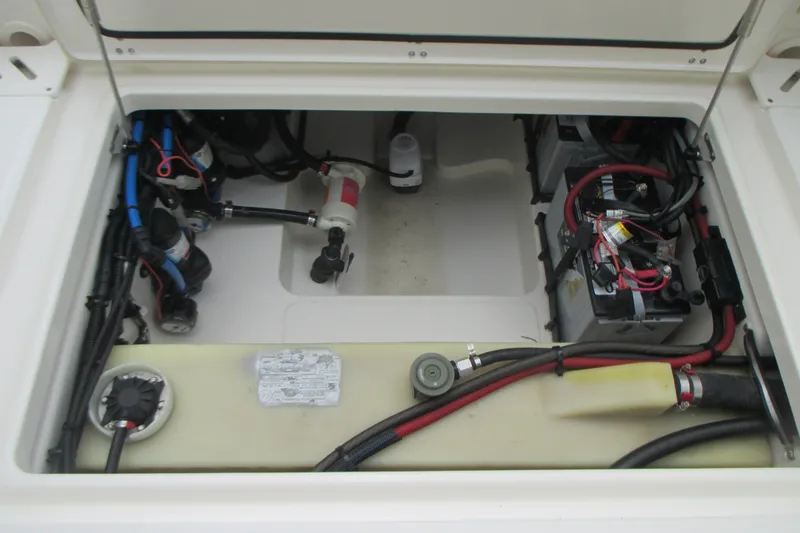 Slide: The Image of Engine compartment of a 2013 Boston Whaler 230 Vantage boat, showing wiring and components. - 18