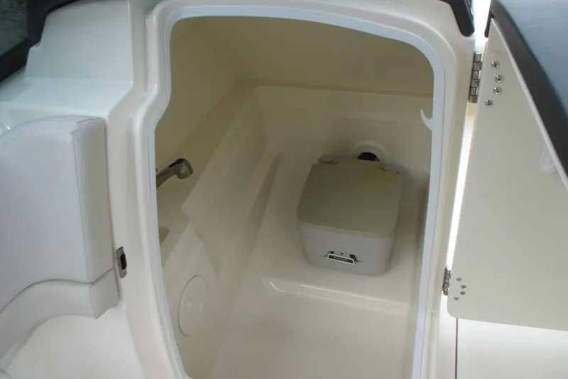 Slide: The Image of Interior of 2013 Boston Whaler 230 Vantage boat with compact toilet. - 13