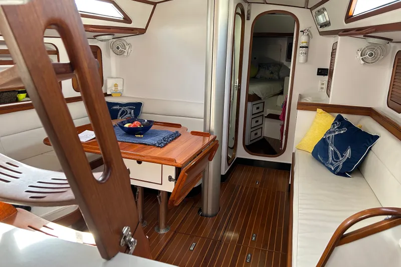 Slide: The Image of Interior of 1989 Hylas 44 yacht with wooden accents and nautical decor. - 17