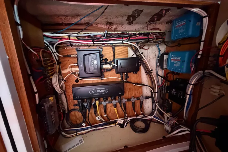 Slide: The Image of Electrical panel of a 1989 Hylas 44 yacht with Garmin equipment and wiring. - 57
