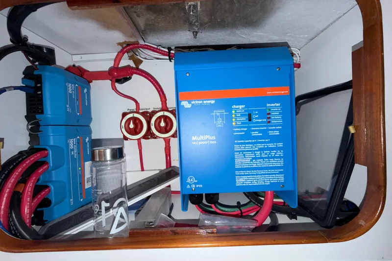Slide: The Image of Electrical system setup on a 1989 Hylas 44 yacht, featuring Victron Energy components. - 48