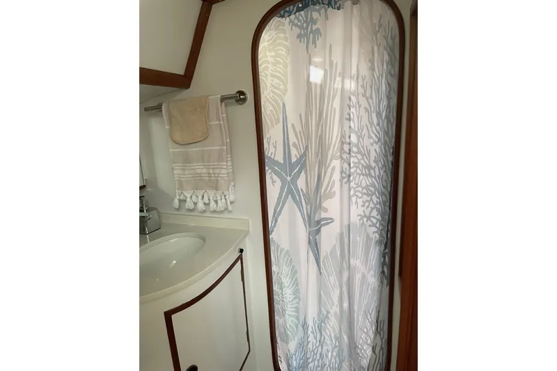 Slide: The Image of Bathroom interior of 1989 Hylas 44 yacht with nautical-themed shower curtain. - 36