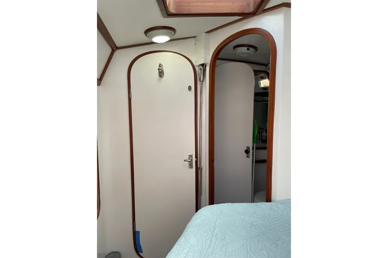 Slide: The Image of Interior of 1989 Hylas 44 yacht showing cabin doors and ceiling light. - 42