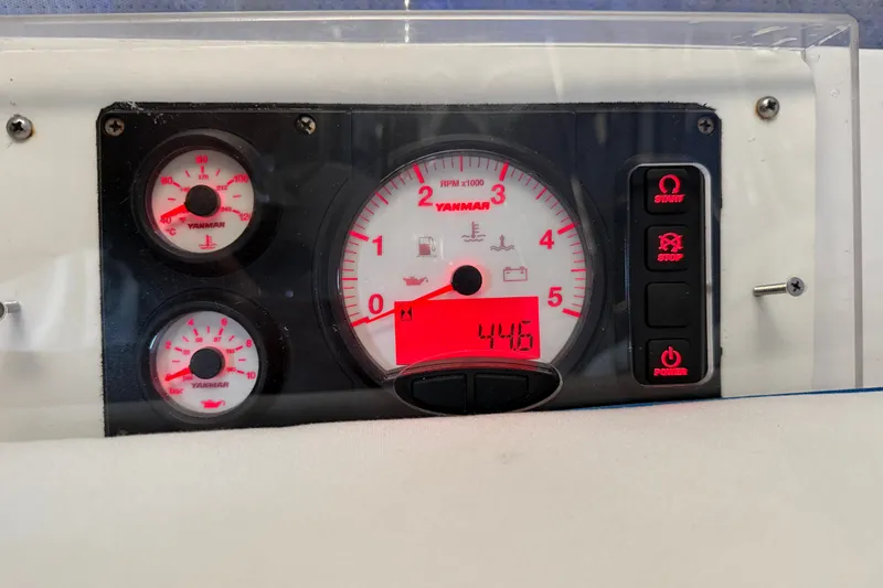 Slide: The Image of Yanmar engine control panel on a 1989 Hylas 44 sailboat, displaying RPM and engine hours. - 13