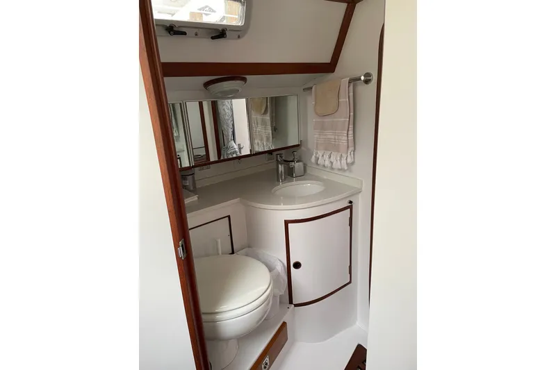 Slide: The Image of Elegant bathroom interior of 1989 Hylas 44 yacht with modern fixtures and wooden accents. - 35
