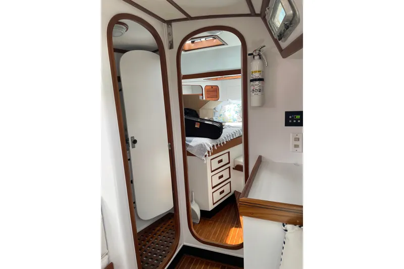 Slide: The Image of Interior of 1989 Hylas 44 yacht, featuring wood accents and cozy cabin space. - 38