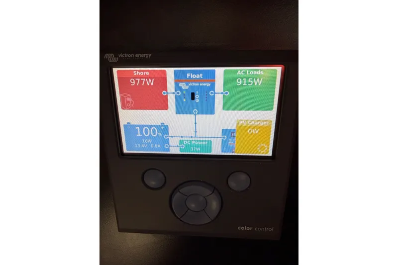 Slide: The Image of Victron Energy control panel displaying power usage on a 1989 Hylas 44 yacht. - 49