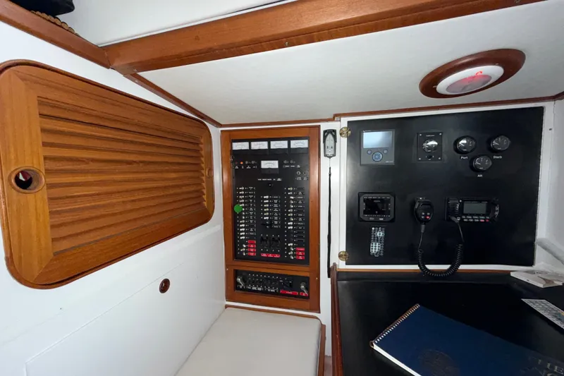Slide: The Image of Control panel of a 1989 Hylas 44 yacht with navigation and communication equipment. - 29