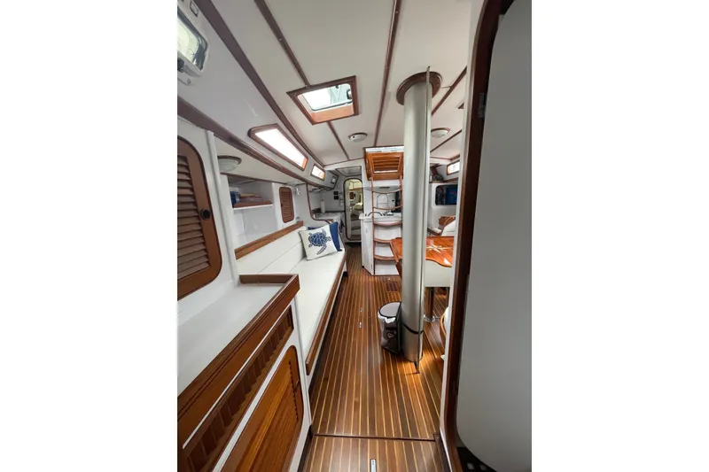 Slide: The Image of Interior of 1989 Hylas 44 yacht with elegant wood finishes and cozy seating. - 24