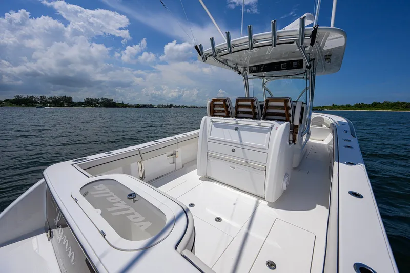 Slide: The Image of 2025 Valhalla Boatworks V-33 on water, featuring sleek design and spacious deck. - 53