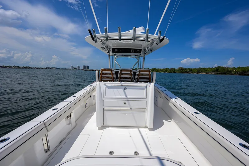 Slide: The Image of 2025 Valhalla Boatworks V-33 on water, showcasing sleek design and spacious deck. - 45
