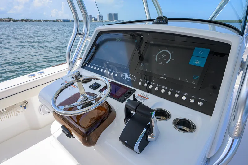 Slide: The Image of 2025 Valhalla Boatworks V-33 helm with advanced navigation display and controls. - 23