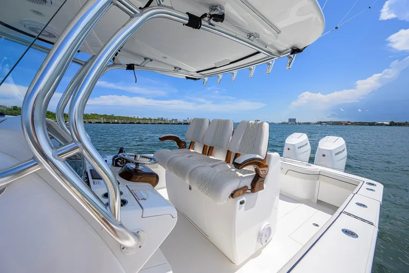Slide: The Image of 2025 Valhalla Boatworks V-33 interior with luxurious seating and dual engines on the water. - 28