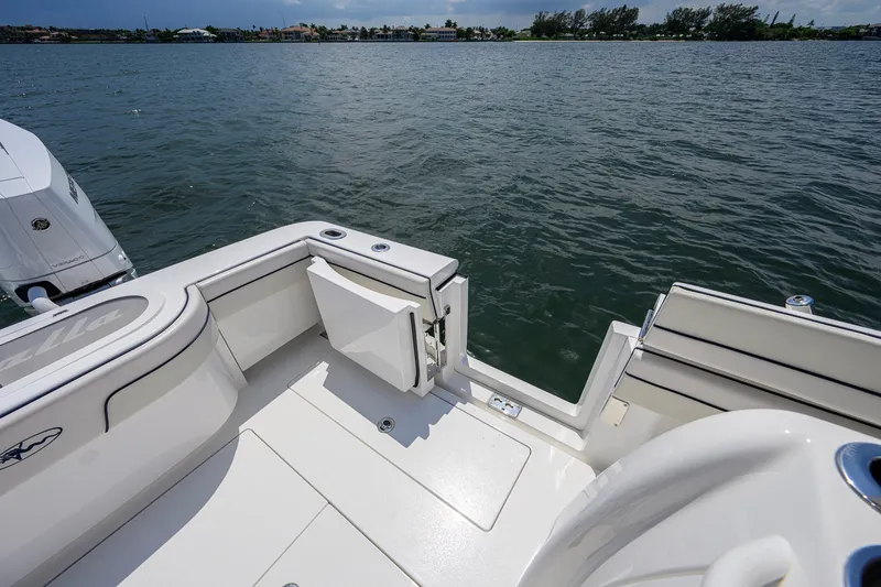 Slide: The Image of 2025 Valhalla Boatworks V-33 deck view with open transom door on water. - 55