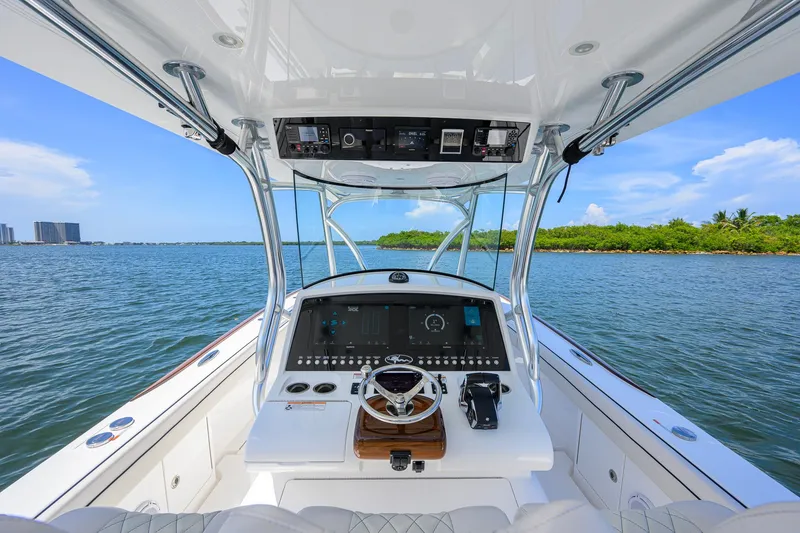 Slide: The Image of Cockpit view of 2025 Valhalla Boatworks V-33 on a sunny day. - 20