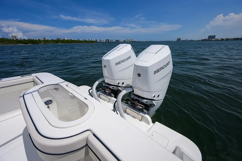 Slide: The Image of 2025 Valhalla Boatworks V-33 with dual Mercury outboard engines on open water. - 74