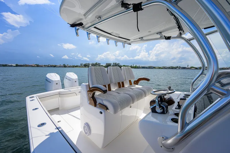 Slide: The Image of 2025 Valhalla Boatworks V-33 interior with luxurious seating and dual Mercury engines. - 27
