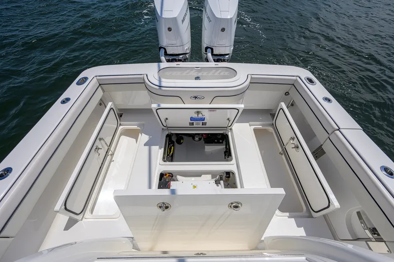 Slide: The Image of 2025 Valhalla Boatworks V-33 deck with open storage compartments and twin engines. - 58