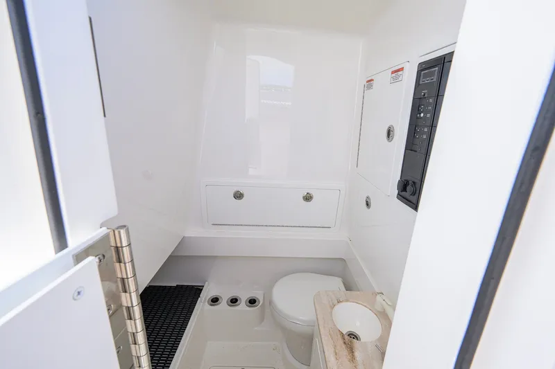 Slide: The Image of 2025 Valhalla Boatworks V-33 interior bathroom with toilet and sink. - 68