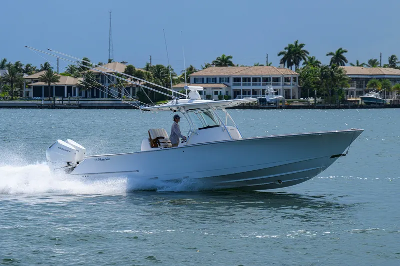 Slide: The Image of 2025 Valhalla Boatworks V-33 cruising on water near waterfront homes. - 13