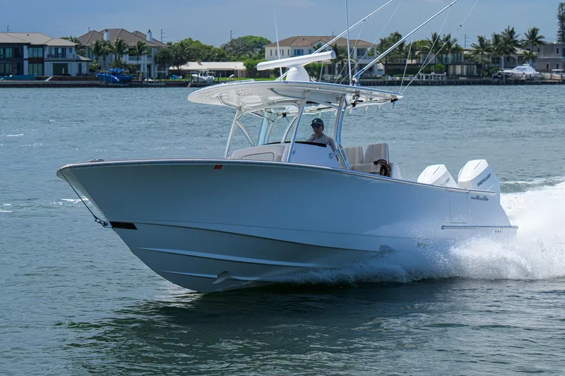 Slide: The Image of 2025 Valhalla Boatworks V-33 cruising on water, showcasing sleek design and powerful performance. - 11