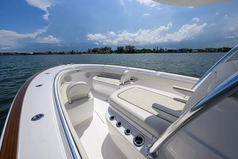 Slide: The Image of 2025 Valhalla Boatworks V-33 interior with luxurious seating on a sunny day. - 43