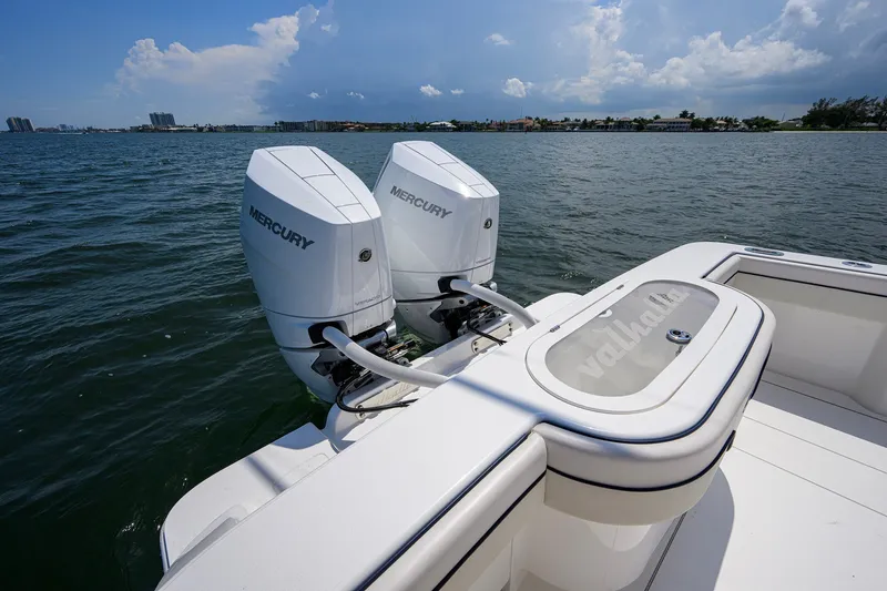 Slide: The Image of 2025 Valhalla Boatworks V-33 with twin Mercury engines on open water. - 77