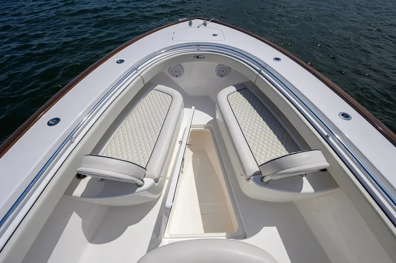 Slide: The Image of 2025 Valhalla Boatworks V-33 bow seating area with quilted cushions on the water. - 42