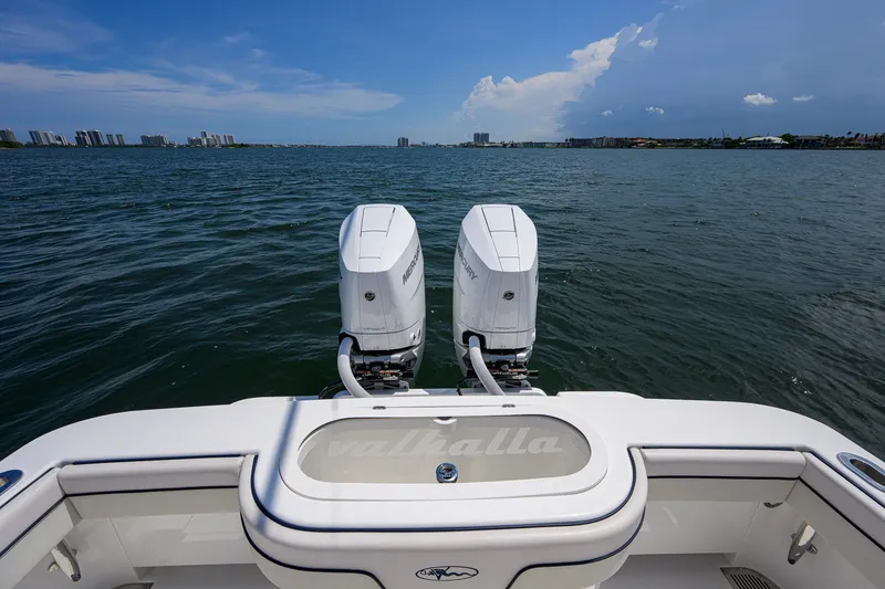 Slide: The Image of 2025 Valhalla Boatworks V-33 with dual Mercury engines on open water. - 75