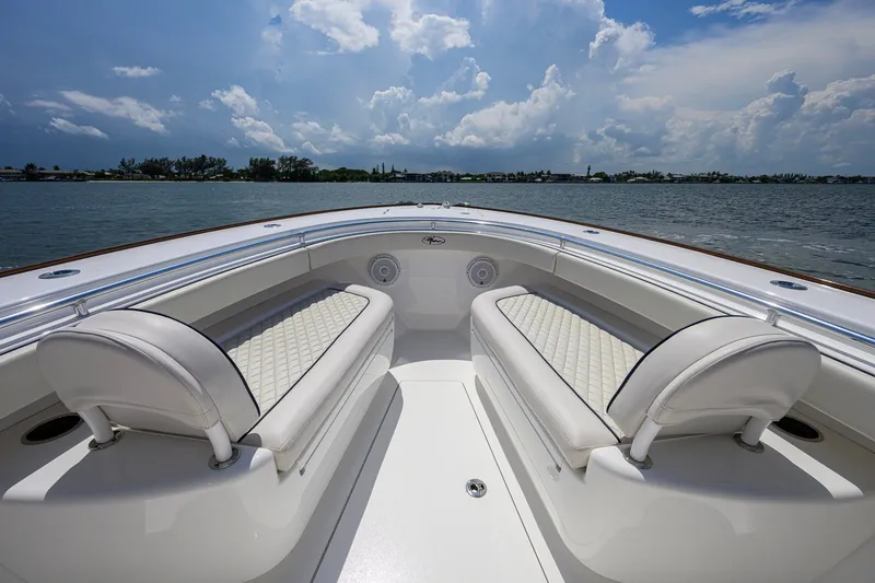Slide: The Image of 2025 Valhalla Boatworks V-33 interior with luxurious seating on a sunny day. - 33