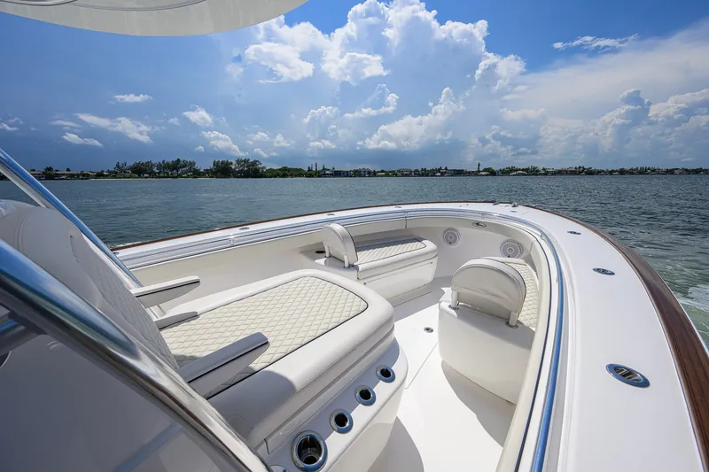 Slide: The Image of 2025 Valhalla Boatworks V-33 interior with luxurious seating on a sunny day. - 31