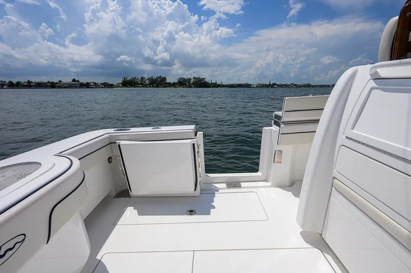Slide: The Image of 2025 Valhalla Boatworks V-33 deck view with ocean backdrop and clear skies. - 54