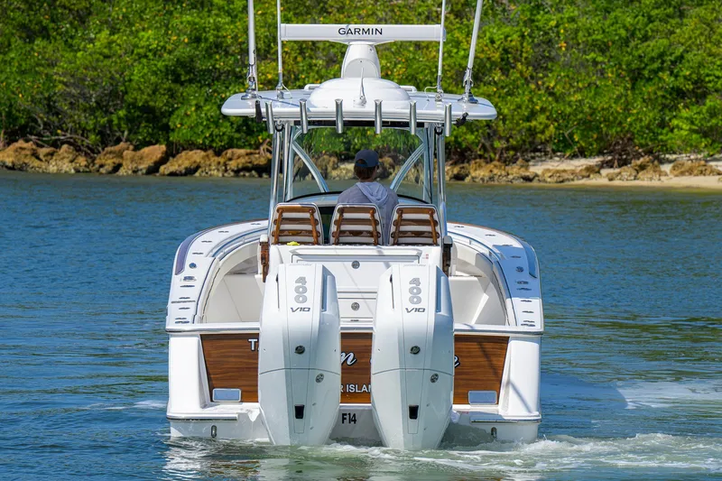 Slide: The Image of 2025 Valhalla Boatworks V-33 cruising on water, featuring dual 400 V10 engines. - 7