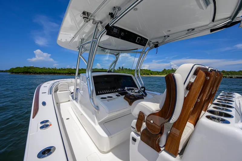 Slide: The Image of 2025 Valhalla Boatworks V-33, sleek design, luxurious seating, and advanced navigation system on open water. - 17