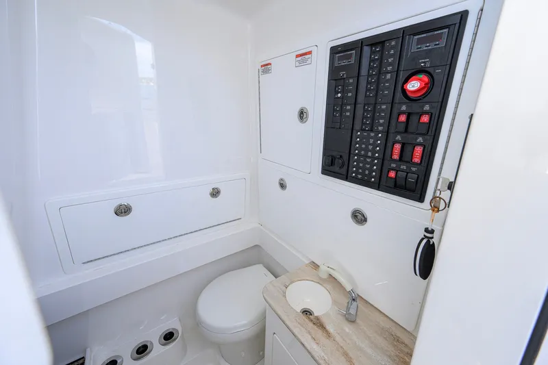Slide: The Image of 2025 Valhalla Boatworks V-33 interior with control panel, toilet, and sink. - 70
