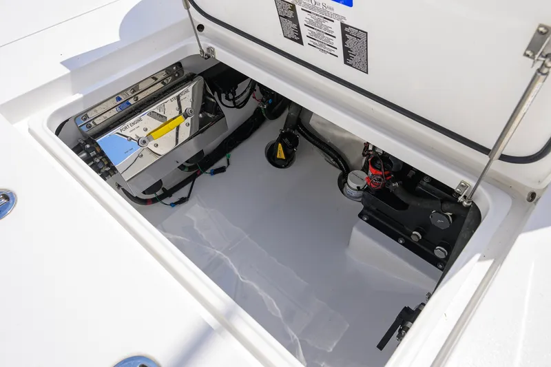 Slide: The Image of Open hatch of 2025 Valhalla Boatworks V-33 showing engine components and wiring. - 65