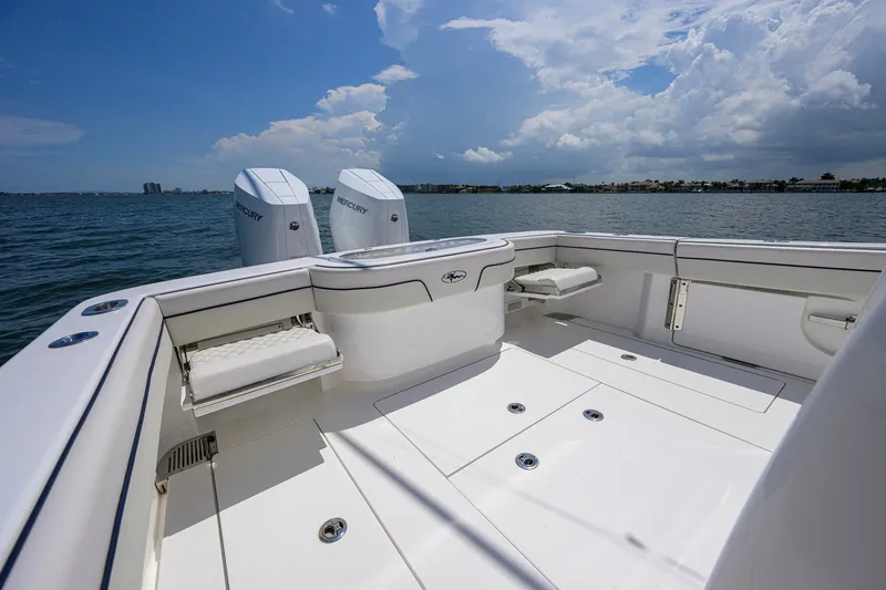 Slide: The Image of 2025 Valhalla Boatworks V-33 deck with twin Mercury engines on open water. - 50