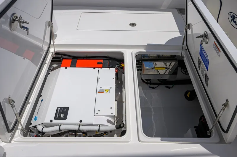 Slide: The Image of 2025 Valhalla Boatworks V-33 engine compartment with open hatches, showcasing modern equipment. - 63