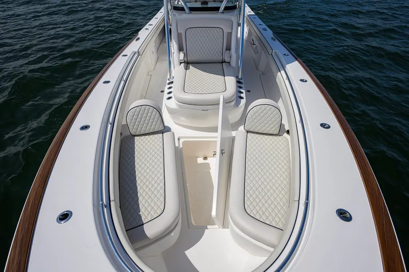 Slide: The Image of 2025 Valhalla Boatworks V-33 with luxurious seating and sleek design on open water. - 38