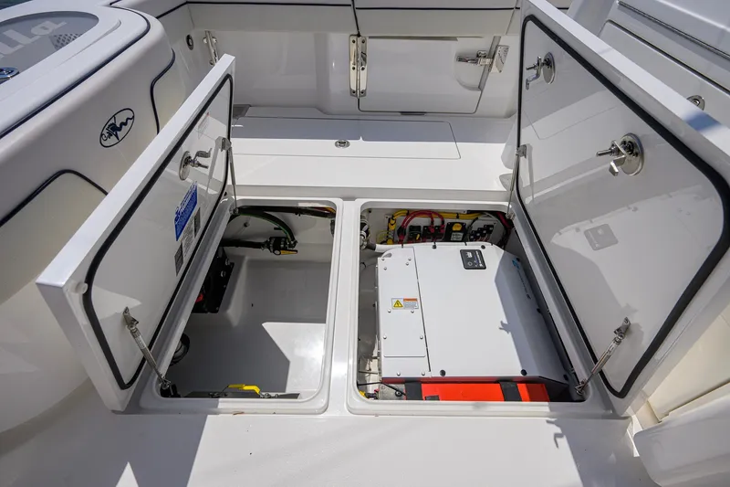 Slide: The Image of 2025 Valhalla Boatworks V-33 storage compartments with electrical components and wiring. - 61