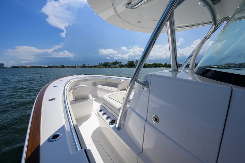 Slide: The Image of 2025 Valhalla Boatworks V-33 on water, showcasing sleek design and luxurious seating. - 44