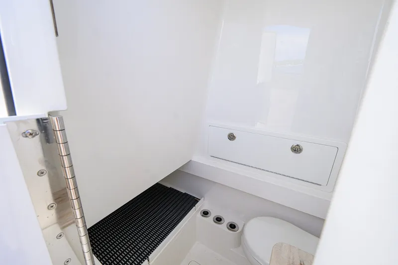 Slide: The Image of 2025 Valhalla Boatworks V-33 interior bathroom with modern fixtures and sleek design. - 69