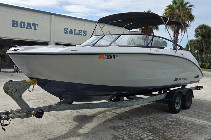 Slide: The Image of 2024 Yamaha Boats SX250 on trailer at boat sales dealership. - 3