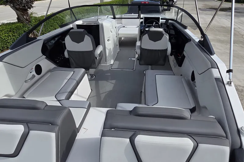 Slide: The Image of 2024 Yamaha Boats SX250 interior with modern seating and sleek design. - 16