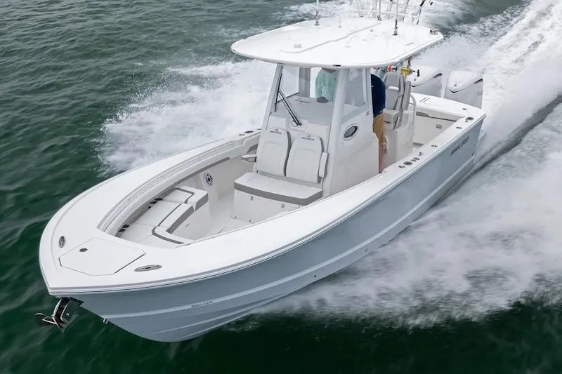 The Image of 2027 Regulator 28 boat cruising swiftly on open water. - 1
