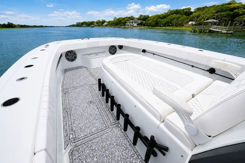 Slide: The Image of Luxurious 2023 Freeman 43 boat interior with white seating and scenic water view. - 10
