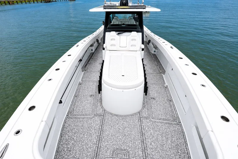 Slide: The Image of 2023 Freeman 43 boat deck with seating, on calm blue water. - 9