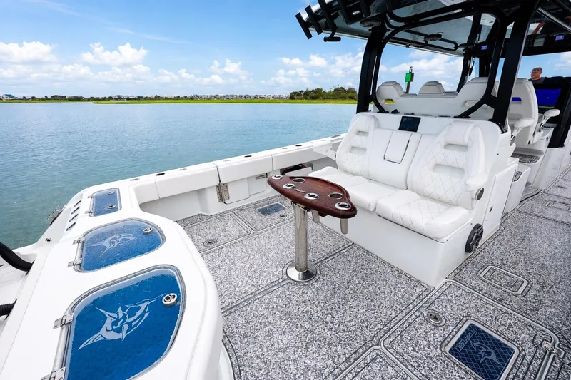 Slide: The Image of Luxury Freeman 43 boat interior with white seating and scenic water view, 2023 model. - 17