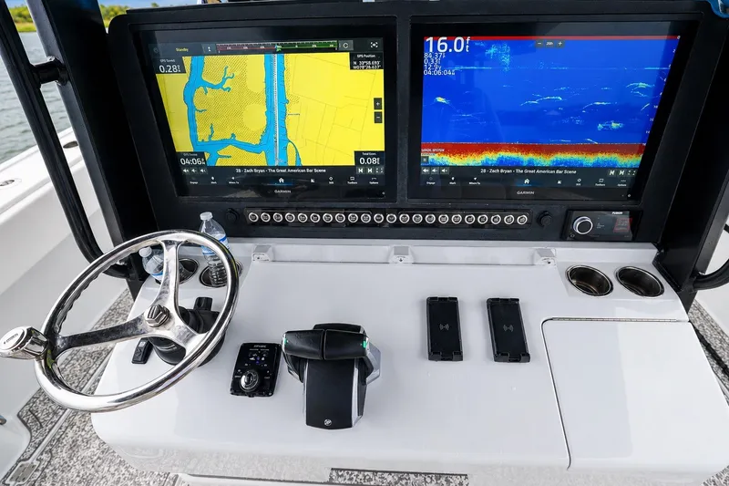 Slide: The Image of Dashboard of 2023 Freeman 43 boat with navigation and sonar displays. - 11