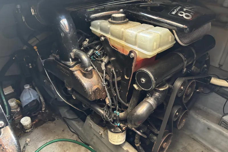 Slide: The Image of Engine compartment of a 2001 Sea Ray 340 Amberjack boat, showcasing mechanical components. - 15